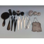 An ebony dressing table set including a silver mounted piece London 1909, button hooks,