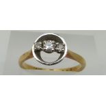 An 18ct gold ring set with three diamonds in a platinum setting, size M, 3.