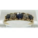 A late Victorian / early Edwardian ring set with three sapphires and two diamonds, size M, 2.
