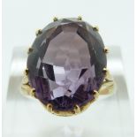 A 9ct gold ring set with an amethyst, size M/N, 6.