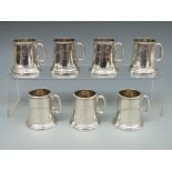 A set of seven novelty white metal miniature glass bottomed tankards all marked Moran Polo Club,