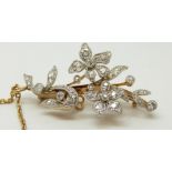 A Belle Epoque diamond set pendant/ brooch in a floral design,