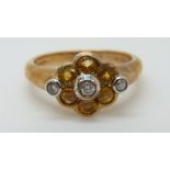 A 9ct gold ring set with citrine and diamonds, size O,