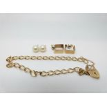 A 9ct gold bracelet, a pair of 9ct gold earrings (6.