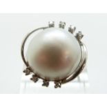 An 18ct white gold ring set with a Mabé pearl and diamonds, size P, 9.