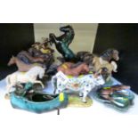 A large collection of Danbury Mint, Heredities and Beswick foals,
