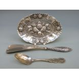 A white metal oval pin dish,