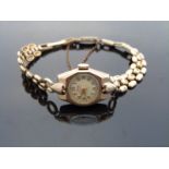 Rone 9ct gold ladies wristwatch with gold hands and Arabic numerals,