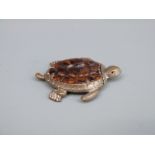 A novelty vesta case in the form of a turtle set with tortoiseshell,