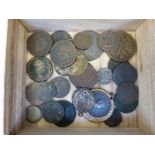 A small wooden cabinet containing ancient coins including Roman,