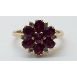 A 9ct gold ring set with rubies and diamonds in a flower cluster, size J/K, 2.