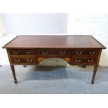 A late 19thC mahogany desk with line inlay decoration,