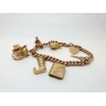 A 9ct rose gold curb link bracelet with six 9ct gold charms and heart padlock, 41.