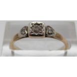 An 18ct gold ring set with diamonds in a platinum setting, size O, 1.
