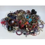 A collection of costume jewellery to include Chinese necklace, tiger's eye bracelet,