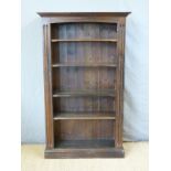 A stained pine bookcase with adjustable shelves,