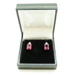 A pair of 9ct gold earrings set with a synthetic ruby and diamonds to each