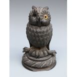 A 19thC carved bog oak owl ink well,