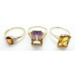 Three 9ct gold rings, one set with tourmaline, one citrine and the other citrine and diamonds,