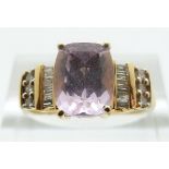 An 18ct gold ring set with a pink topaz and diamonds, size O, 4.