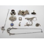 A filigree brooch, two diamanté necklaces,