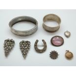 A hallmarked silver bangle, silver napkin ring, pair of Victorian clips set with foiled paste,