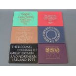 Six brilliant uncirculated Royal Mint coinage sets for Britain and Northern Ireland 1970 - 1975