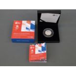 A cased silver proof 2016 Team GB Rio 50 pence coin depicting swimmer,