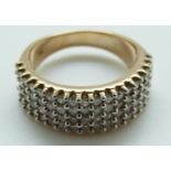 A 9ct gold ring set with diamonds in four rows, size O, 7.