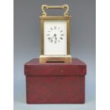 A French style mid to late 20thC brass carriage clock with reeded decoration to square corners.