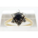 An 18ct gold ring set with a sapphire surrounded by diamonds, size M, 4.