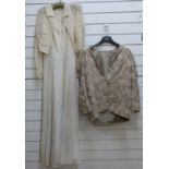 A 1950's lace wedding dress and matching jacket with mother of pearl buttons