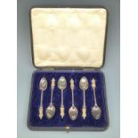 A cased set of George V suffragette figural top teaspoons,