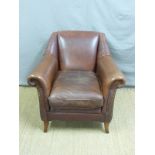 A brown leather arm chair