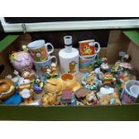 A collection of Garfield ceramics to include Danbury Mint figures, mugs, egg cups, money box,