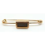 A 9ct rose gold mourning brooch with a rectangular section set with plaited hair