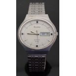 Bulova gentleman's wristwatch with day and date aperture, two tone steel hands and baton markers,