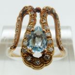 A yellow metal ring set with a pear cut aquamarine and diamonds, size K/L, 4.