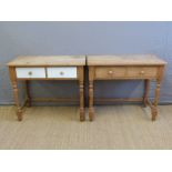 A pair of pine two drawer side tables,