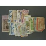 A collection of world bank notes in used condition, but some still crisp,