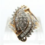 A 9ct gold ring set with baguette and round cut diamonds in a cluster, size P, 4.