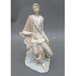 Lladro figure of a man seated on a tree stump