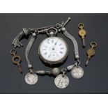 A white metal cased ladies fob watch with floral decoration to the white enamel dial,