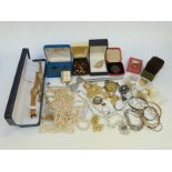 A collection of costume jewellery to include beads, boxed silver cufflinks,