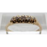 An 18ct gold Victorian ring set with a five old cut diamonds, size P, 2.