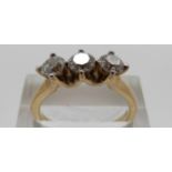A 9ct gold ring set with three modern round brilliant cut diamonds totalling approximately 1ct,