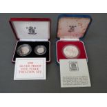 A cased 1990 silver proof five pence coin set and a 1977 Queen Elizabeth II Silver Jubilee silver
