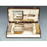 A cased hallmarked silver five piece dressing table set,