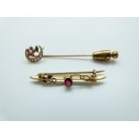 A 14ct gold stick pin set with seed pearls and enamel in the form of a crescent and flower and a