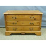 A pine dressing chest with swing frame mirror above,